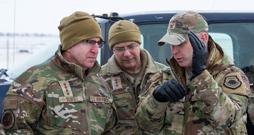 U.S. Air Force Gen. Jim Slife (left), Air Force vice chief of staff (VCSAF), U.S. Air Force Lt. Gen. Andrew Gebara (center), Air Force deputy chief of staff for strategic deterrence and nuclear integration, and U.S. Air Force Col. Jimmy Schlabach (right), 91st Missile Wing commander, converse during a base visit at a missile launch facility near Minot Air Force Base, North Dakota, Feb. 15, 2025. During the visit, Slife and Gebara met with Airmen assigned to multiple units which contribute to the nation’s nuclear deterrence capabilities. (U.S. Air Force photo by Senior Airman Kyle Wilson)