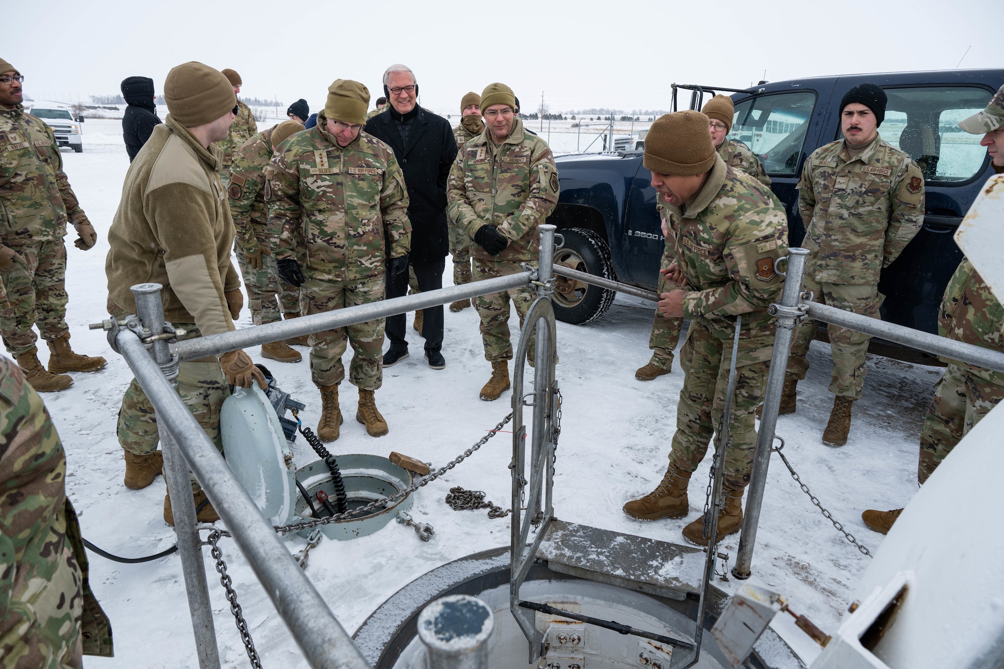 U.S. Air Force Gen. Jim Slife (center left), Air Force vice chief of staff (VCSAF), and U.S. Air Force Lt. Gen. Andrew Gebara (center), Air Force deputy chief of staff for strategic deterrence and nuclear integration, receive a briefing from Airmen assigned to the 91st Missile Wing during a base visit at a missile launch facility (LF) near Minot Air Force Base, North Dakota, Feb. 15, 2025. The 91MW operates a network of LFs which cover 8,500 square miles of North Dakota and house the Minuteman III intercontinental ballistic missile weapon system. (U.S. Air Force photo by Senior Airman Kyle Wilson)