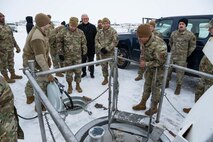 U.S. Air Force Gen. Jim Slife (center left), Air Force vice chief of staff (VCSAF), and U.S. Air Force Lt. Gen. Andrew Gebara (center), Air Force deputy chief of staff for strategic deterrence and nuclear integration, receive a briefing from Airmen assigned to the 91st Missile Wing during a base visit at a missile launch facility (LF) near Minot Air Force Base, North Dakota, Feb. 15, 2025. The 91MW operates a network of LFs which cover 8,500 square miles of North Dakota and house the Minuteman III intercontinental ballistic missile weapon system. (U.S. Air Force photo by Senior Airman Kyle Wilson)