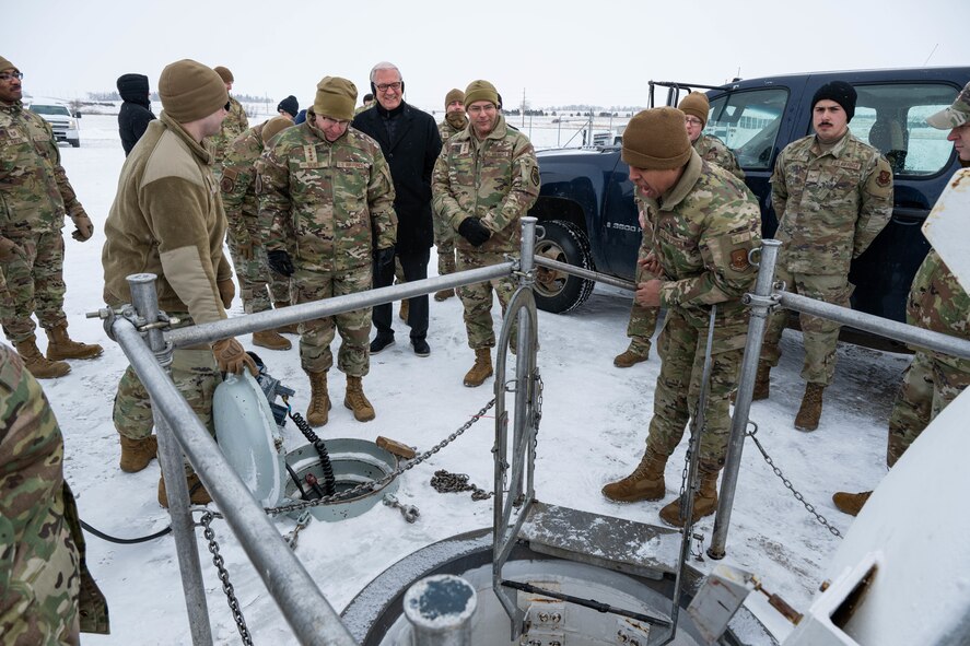 U.S. Air Force Gen. Jim Slife (center left), Air Force vice chief of staff (VCSAF), and U.S. Air Force Lt. Gen. Andrew Gebara (center), Air Force deputy chief of staff for strategic deterrence and nuclear integration, receive a briefing from Airmen assigned to the 91st Missile Wing during a base visit at a missile launch facility (LF) near Minot Air Force Base, North Dakota, Feb. 15, 2025. The 91MW operates a network of LFs which cover 8,500 square miles of North Dakota and house the Minuteman III intercontinental ballistic missile weapon system. (U.S. Air Force photo by Senior Airman Kyle Wilson)