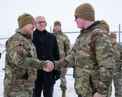 U.S. Air Force Gen. Jim Slife (left), Air Force vice chief of staff (VCSAF), coins U.S. Air Force Staff Sgt. Kai LeBlanc, 91st Missile Security Forces Squadron training instructor, during a base visit at a missile launch facility near Minot Air Force Base, North Dakota, Feb. 15, 2025. Slife presented LeBlanc with the coin as a recognition of exceptional performance. (U.S. Air Force photo by Senior Airman Kyle Wilson)