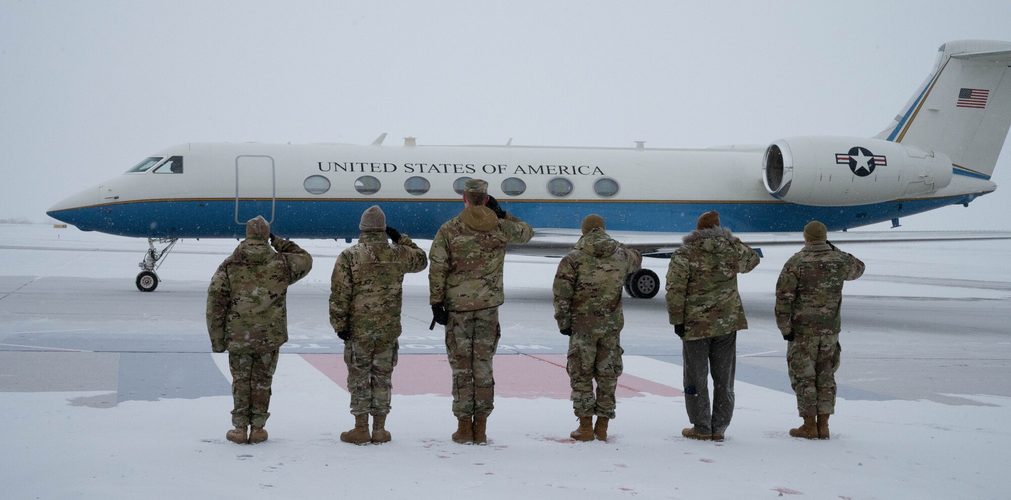 Team Minot leadership salute the plane carrying U.S. Air Force Gen. Jim Slife, Air Force vice chief of staff VCSAF), in preparation for a base and operations tour at Minot Air Force Base, North Dakota, Feb. 15, 2025. Slife visited Minot AFB to discuss facilities sustainment, restoration and
modernization. (U.S. Air Force photo by Airman 1st Class Wesley Davies)