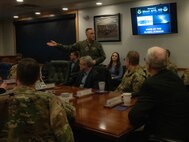 U.S. Air Force Col. Jesse Lamarand, 5th Bomb Wing commander, begins a presentation on the operations and mission of Minot Air Force Base for U.S. Air Force Gen. Jim Slife, Air Force vice chief of staff (VCSAF), at Minot Air Force Base, North Dakota, Feb. 15, 2025. Slife visited Minot AFB to discuss facilities sustainment, restoration and modernization. (U.S. Air Force photo by Airman 1st Class Wesley Davies)