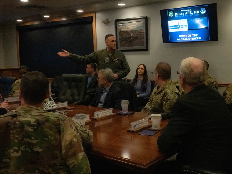 U.S. Air Force Col. Jesse Lamarand, 5th Bomb Wing commander, begins a presentation on the operations and mission of Minot Air Force Base for U.S. Air Force Gen. Jim Slife, Air Force vice chief of staff (VCSAF), at Minot Air Force Base, North Dakota, Feb. 15, 2025. Slife visited Minot AFB to discuss facilities sustainment, restoration and modernization. (U.S. Air Force photo by Airman 1st Class Wesley Davies)