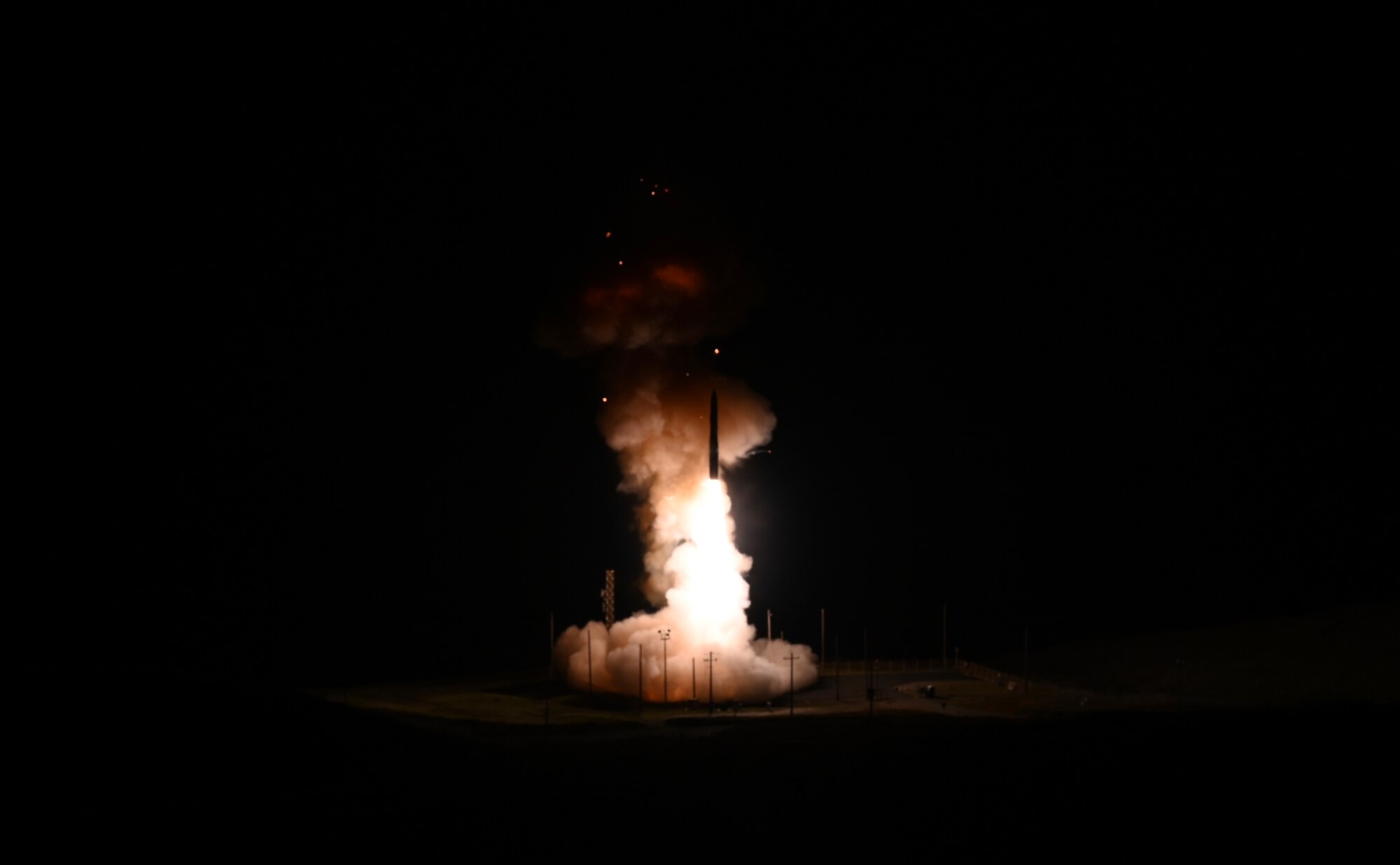 A missile is launched out of the ground.