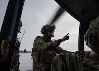 U.S. Air Force Staff Sgt. Robert Taulman, 91st Missile Security Operations Squadron convoy response force fire observer, enters a UH-1N Iroquois assigned to the 54th Helicopter Squadron (54HS) at Minot Air Force Base, North Dakota, Feb. 7, 2025. In addition to providing helicopter security response for the 91st Missile Wing, the 54HS supports emergency war orders by delivering tactical response force teams to assist with convoy operations, launch facility denial and recapture. (U.S. Air Force photo by Senior Airman Alyssa Bankston)