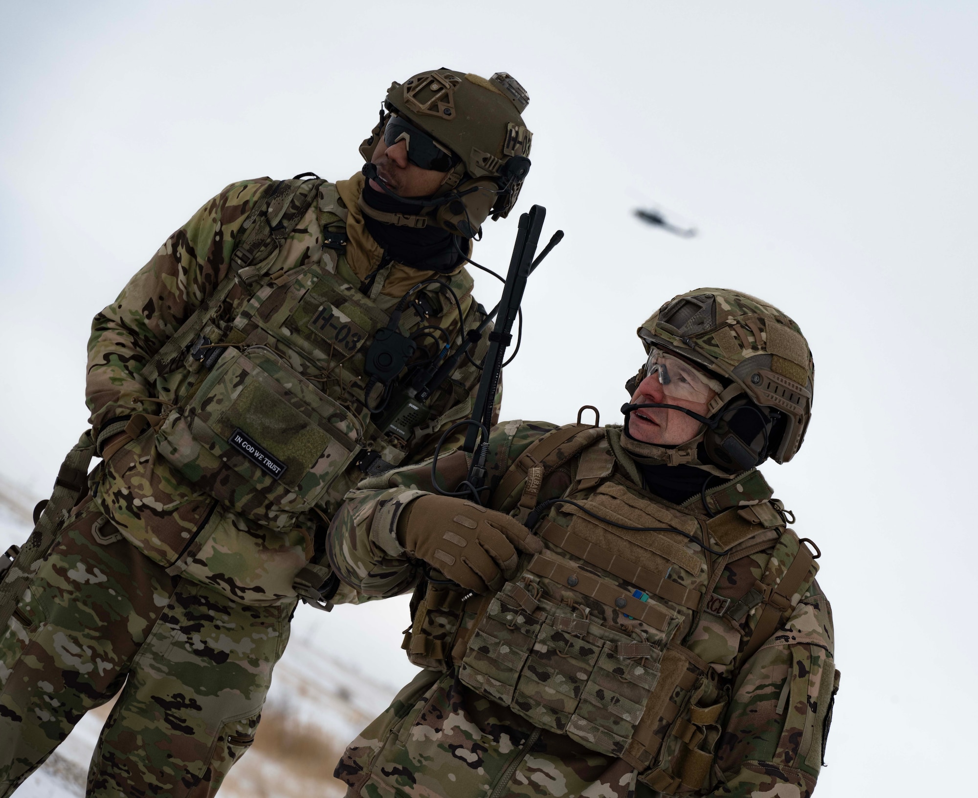 Senior Airman Daquane Williams, 91st Missile Security Operations Squadron convoy response force fire observer (left), and Chief Master Sgt. Matthew Tinck, 91st Operations Group senior enlisted leader (right), provide close air support (CAS) for training at Minot Air Force Base, North Dakota, Feb. 7, 2025. CAS is a military tactic involving the use of aircraft to attack enemy targets near friendly forces. (U.S. Air Force photo by Senior Airman Alyssa Bankston)