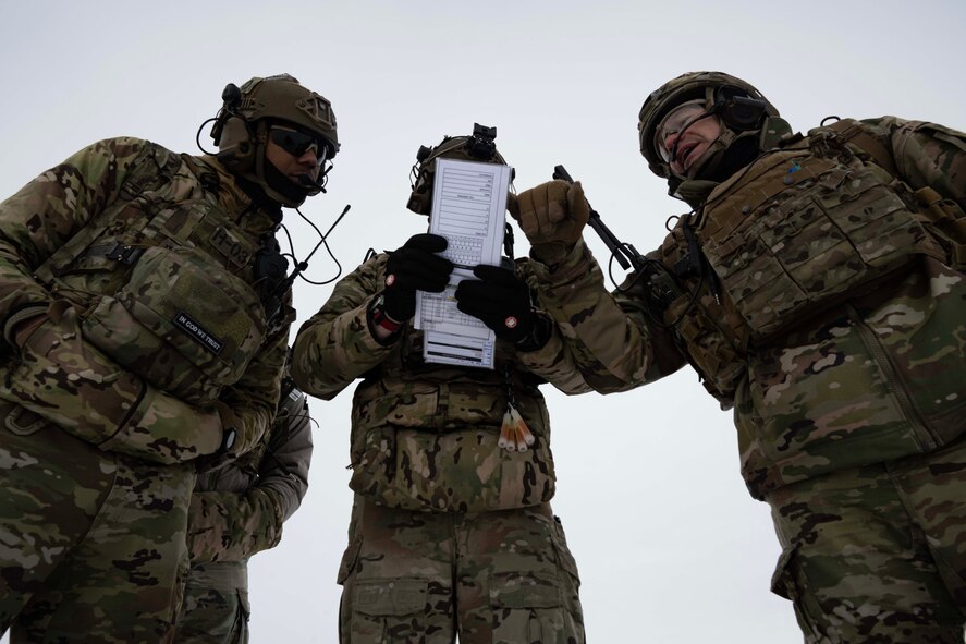 Chief Master Sgt. Matthew Tinck, 91st Operations Group senior enlisted leader (right), Senior Airman Daquane Williams (left) and U.S. Air Force Staff Sgt. Robert Taulman (center), 91st Missile Security Operations Squadron (91MSOS) convoy response force fire observer, provide close air support (CAS) for training at Minot Air Force Base, North Dakota, Feb. 7, 2025. Part of the 91st Security Forces Group at Minot Air Force Base, the 91MSOS protects Team Minot’s Minuteman III missiles and launch facilities.  (U.S. Air Force photo by Senior Airman Alyssa Bankston)