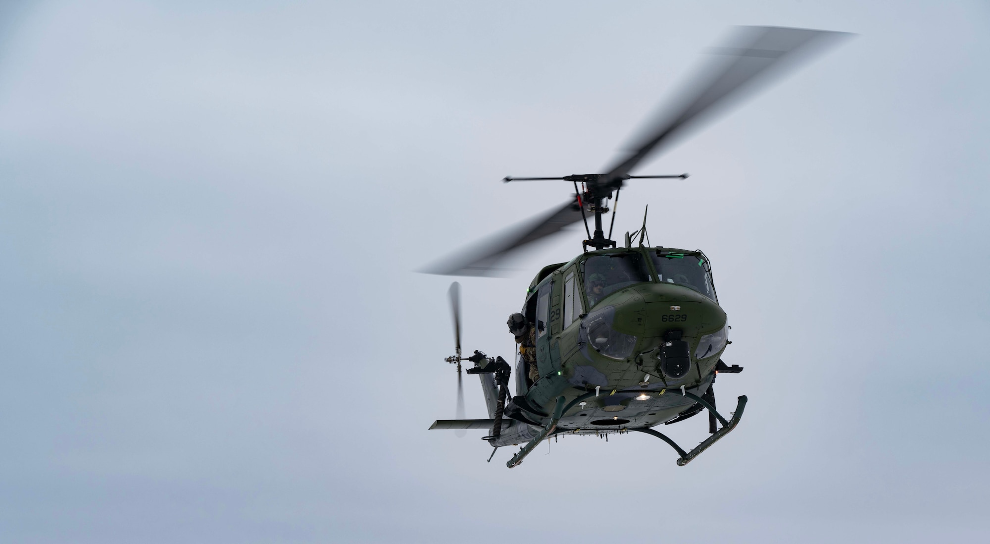 A UH-1N Iroquois assigned to the 54th Helicopter Squadron lands at a training site at Minot Air Force Base, North Dakota, Feb. 7, 2025. Since the 1950s, the UH-1 “Huey” has been used by the Department of Defense with widespread use during the Vietnam War. (U.S. Air Force photo by Senior Airman Alyssa Bankston)