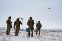 91st Missile Security Operations Squadron (91MSOS) convoy response force fire observers and Chief Master Sgt. Matthew Tinck, 91st Operations Group senior enlisted leader, provide close air support for training at Minot Air Force Base, North Dakota, Feb. 7, 2025. The 91MSOS protects Team Minot’s Minuteman III missiles and launch facilities. (U.S. Air Force photo by Senior Airman Alyssa Bankston)