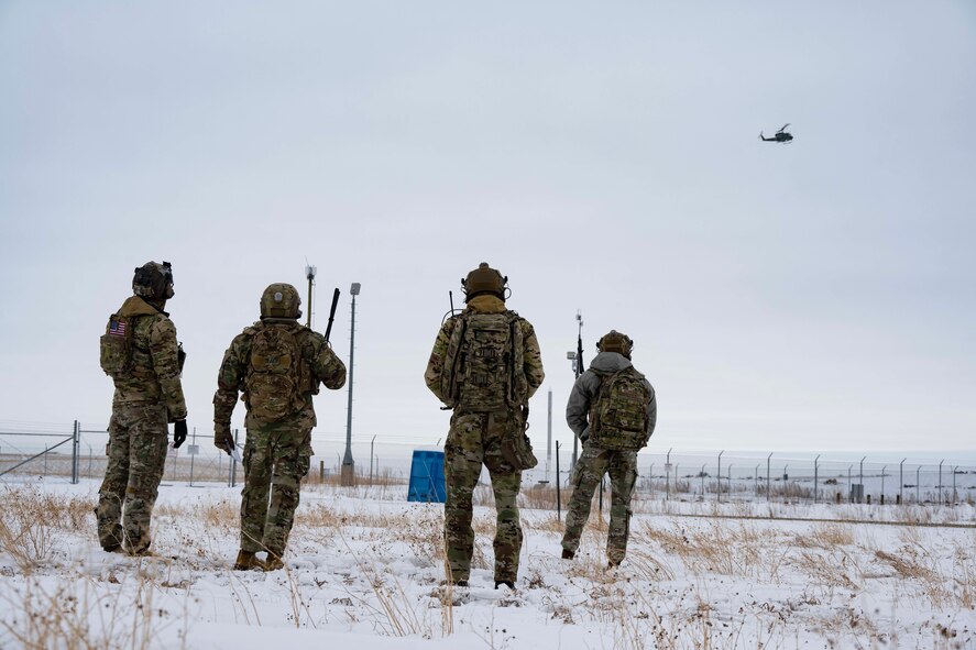 91st Missile Security Operations Squadron (91MSOS) convoy response force fire observers and Chief Master Sgt. Matthew Tinck, 91st Operations Group senior enlisted leader, provide close air support for training at Minot Air Force Base, North Dakota, Feb. 7, 2025. The 91MSOS protects Team Minot’s Minuteman III missiles and launch facilities. (U.S. Air Force photo by Senior Airman Alyssa Bankston)