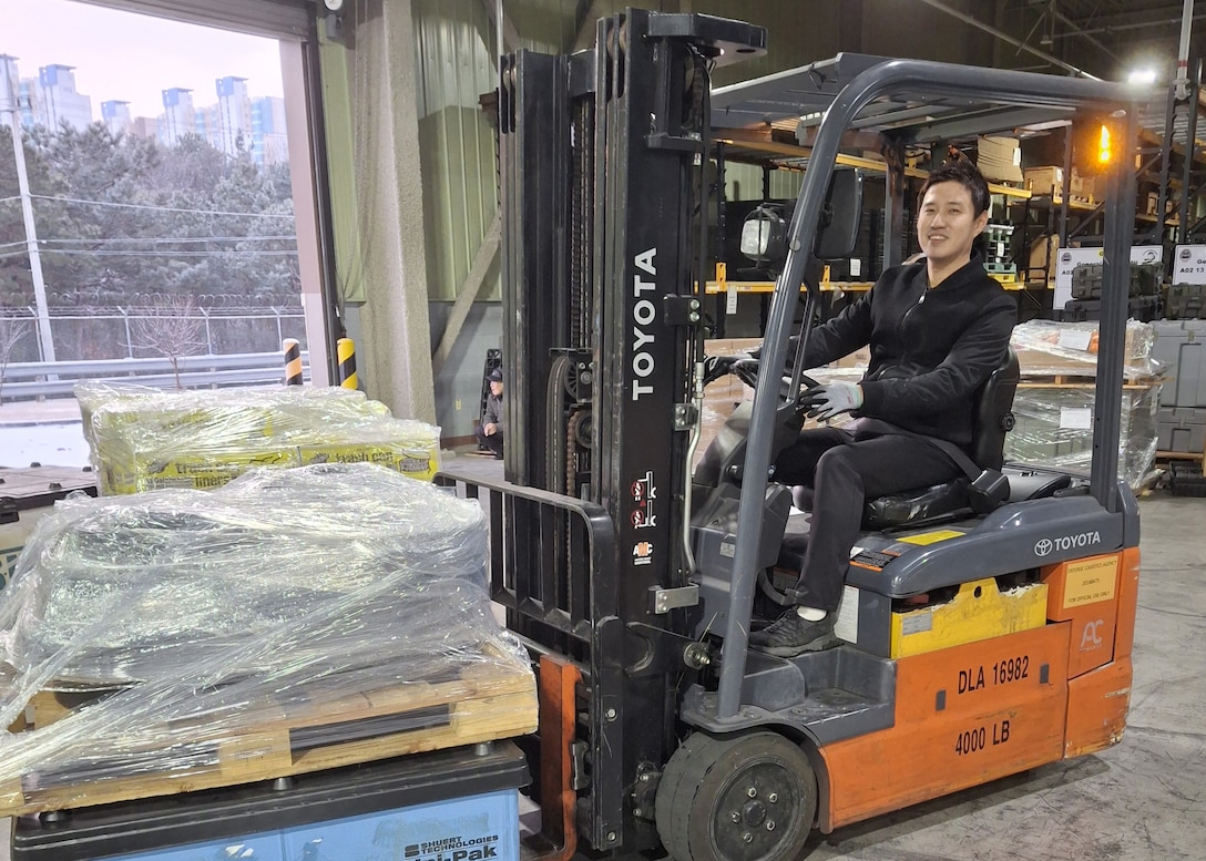 A man on a forklift