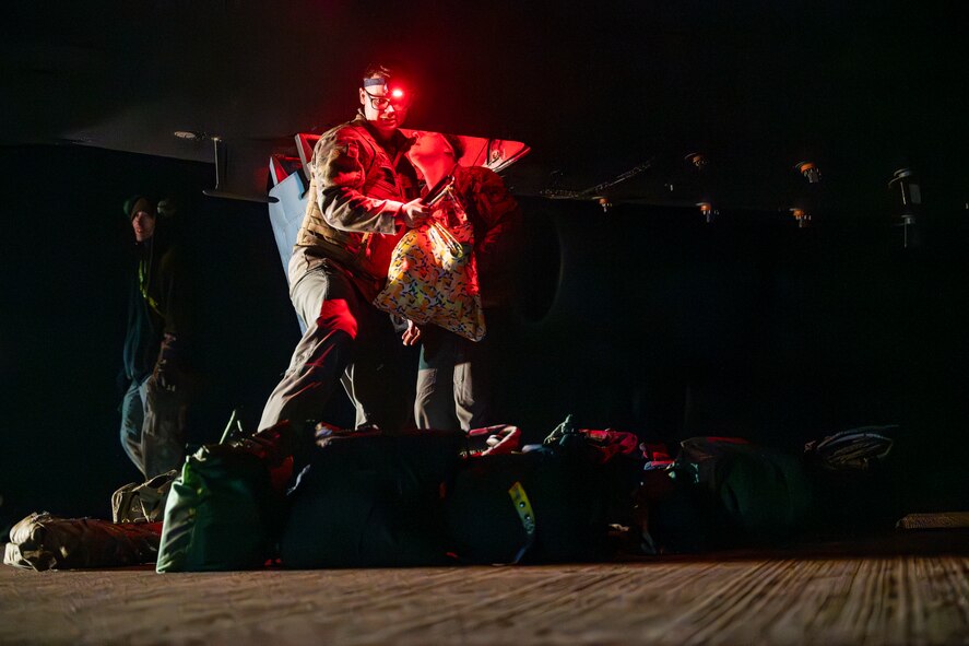 A U.S. Air Force aircrew member removes flight gear after returning from a sortie in support of the Bomber Task Force 25-2 deployment at RAF Fairford, England, Feb. 18, 2025. Regular bomber presence in Europe reinforces U.S. security commitments to NATO. (U.S. Air Force photo by Staff Sgt. Kristen Heller)