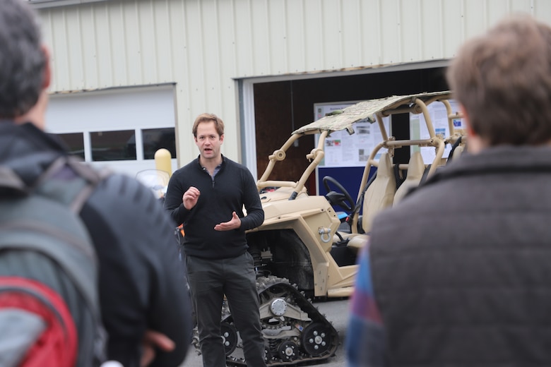 ERDC-CRREL research physicist Dr. Anthony Fragoso demonstrates CRREL mobility laboratory vehicles to snow sciences workshop attendees.