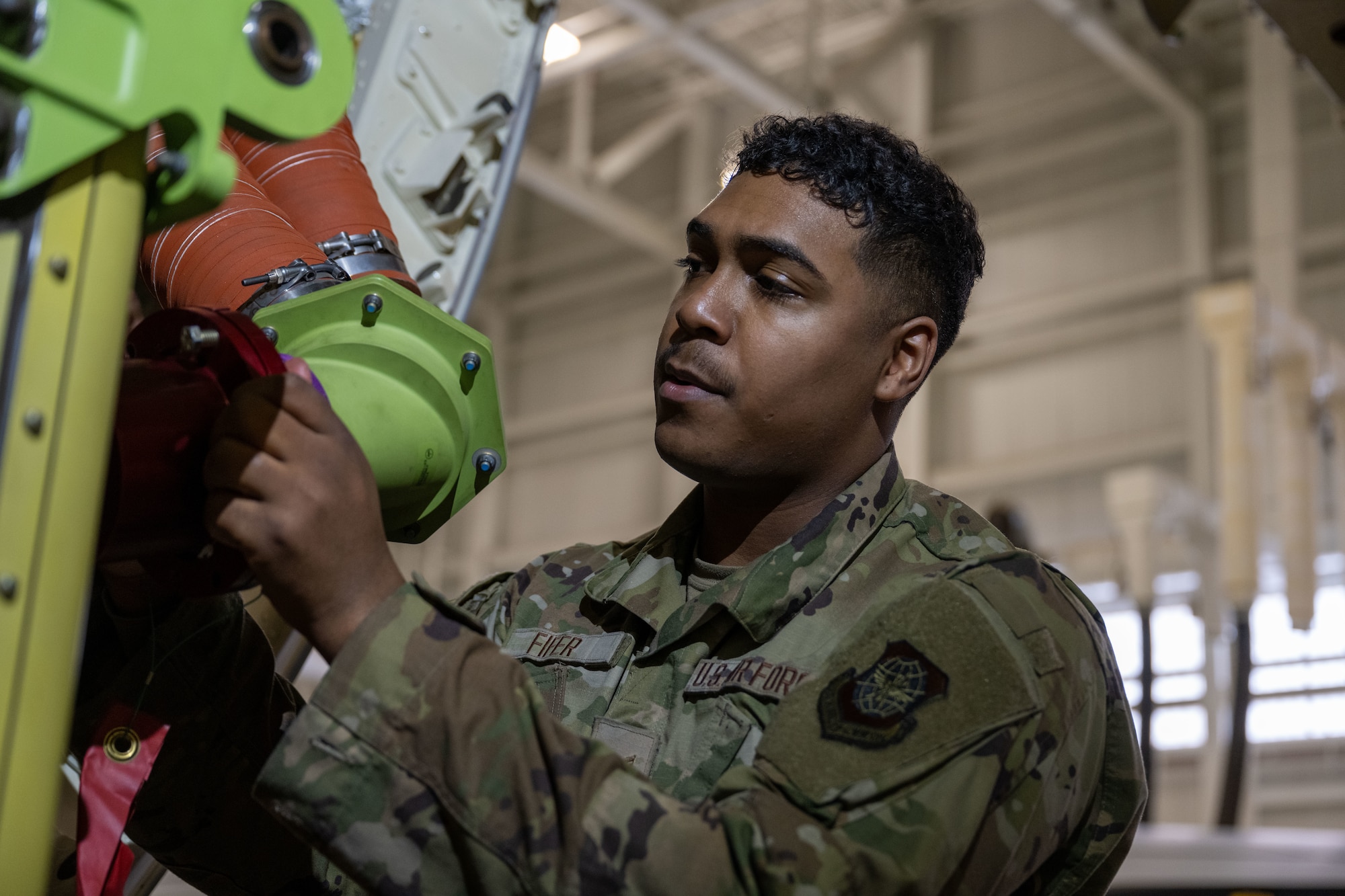 Airman 1st Class Déjon Fifer, 22nd Maintenance Squadron aircraft fuel systems journeyman, removes a fuel hose at McConnell Air Force Base, Kansas, Feb.7, 2025. The KC-46A Pegasus has three fuel tanks that can hold up to 212,299 pounds of fuel combined. (U.S. Air Force photo by Senior Airman Felicia Przydzial)