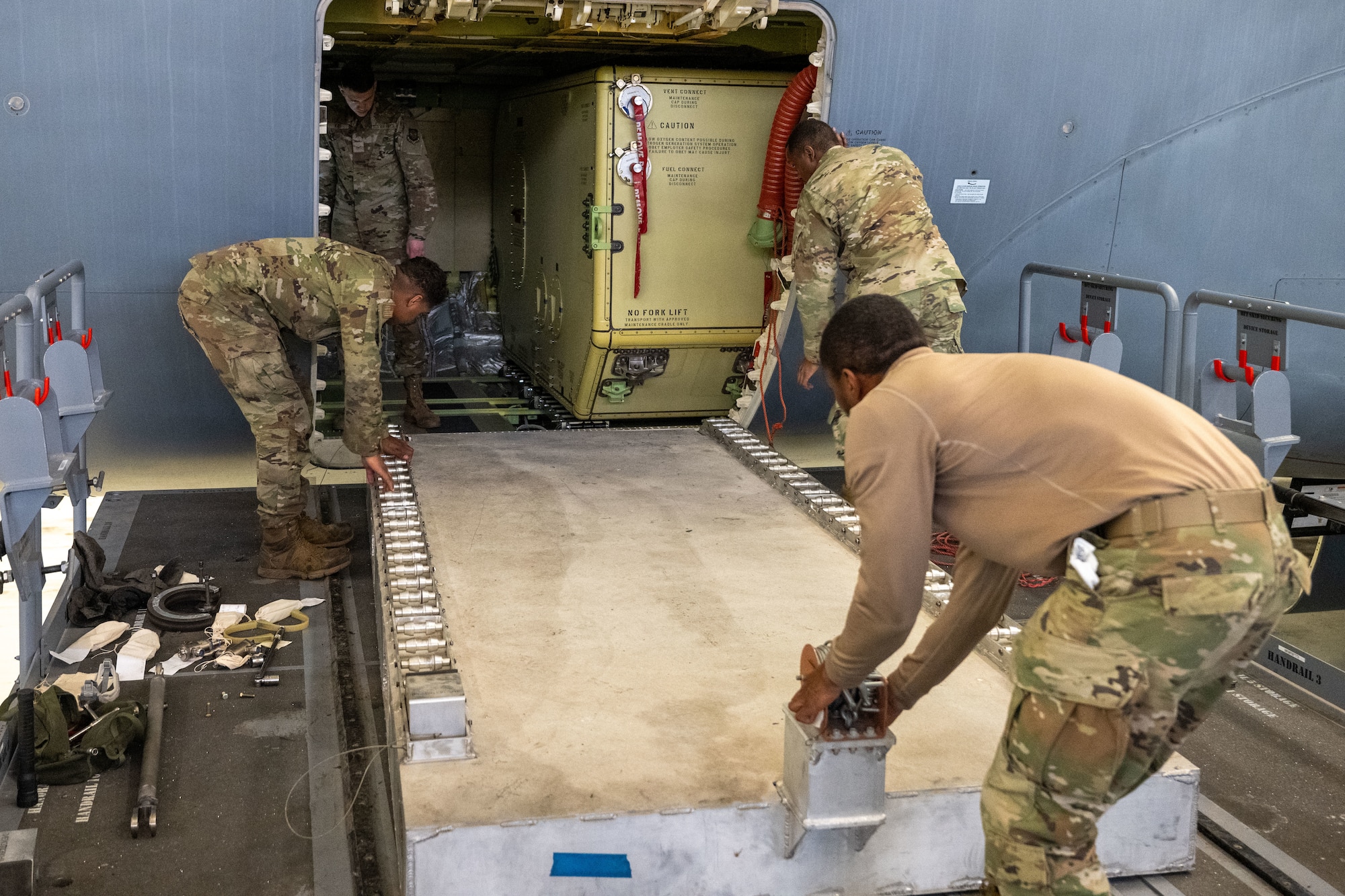 Airmen from the 22nd Maintenance Squadron fuel systems flight prepare a KC-46A Pegasus fuel cell for removal at McConnell Air Force Base, Kansas, Feb. 7, 2025. Aircraft fuel systems Airmen are responsible for inspecting fuel cells and tanks for corrosion, cell deterioration and other foreign objects. (U.S. Air Force photo by Senior Airman Felicia Przydzial)