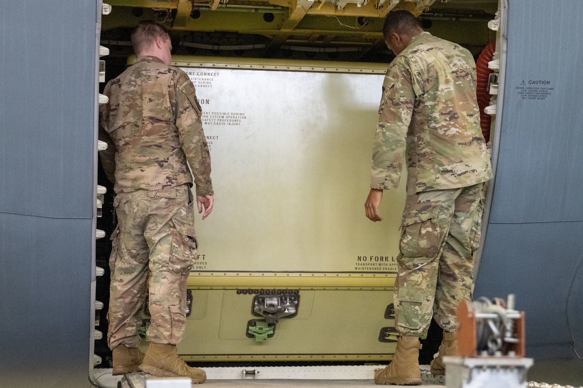 From left, Tech. Sgt. Nathan Janzer, 22nd Maintenance Squadron aircraft fuel systems craftsman, and Tech. Sgt. Darryan Lane, 22nd MXS aircraft fuel systems shift lead, prepare a KC-46A Pegasus fuel cell for removal at McConnell Air Force Base, Kansas, Feb. 7, 2025. Aircraft fuel systems Airmen are responsible for inspecting fuel cells and tanks for corrosion, cell deterioration and other foreign objects. (U.S. Air Force photo by Senior Airman Felicia Przydzial)