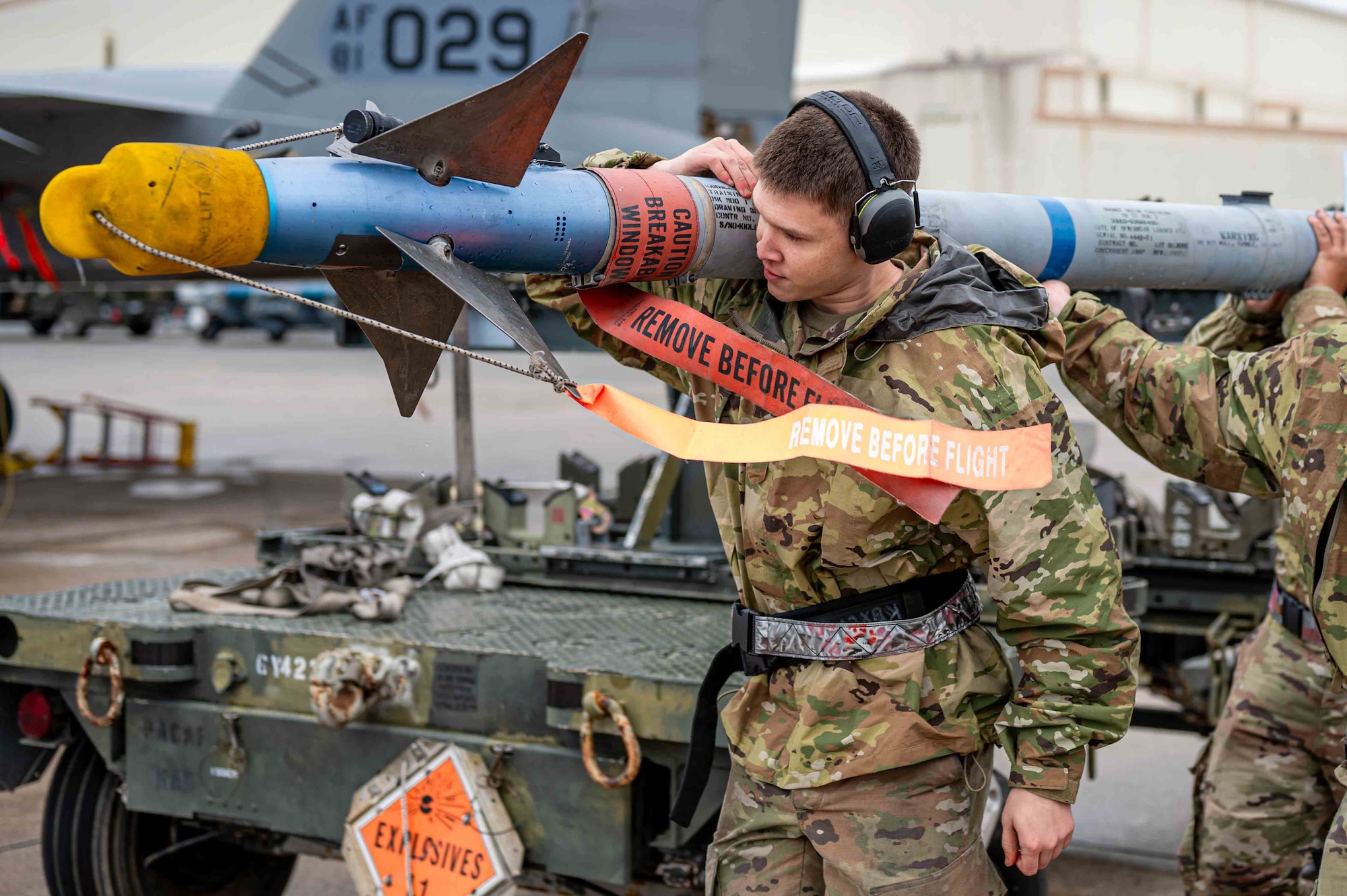 U.S. Air Force Airman 1st Class Dylan Funderburk, 67th Fighter Generation Squadron weapons load crew member, carries munitions during a weapons load competition at Kadena Air Base, Japan, Feb. 7, 2025.