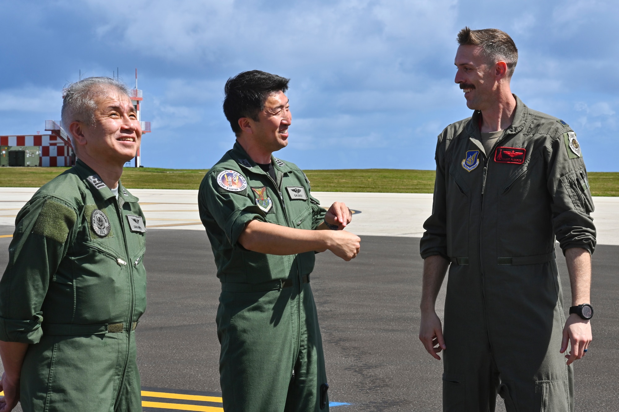 U.S. Air Force Lt. Col. Ryan Plourde (right), 34th Expeditionary Bomb Squadron deputy commander, speaks with members of the Japanese Air Defense Command during an immersion tour of a B-1B Lancer during Bomber Task Force 25-1 at Andersen Air Force Base, Guam, Feb. 12, 2025.