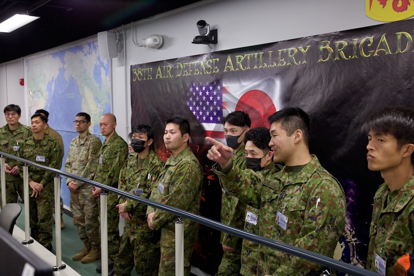 SAGAMI GENERAL DEPOT, Japan - Japanese Ground Self Defense Force Soldiers receive a mission brief about the 38th Air Defense Artillery Brigade integrated air and missile defense, command and control structure and the brigade has been working closely with various allies and partners throughout the Indo-Pacific theater at the brigade headquarters on February 12, 2025.