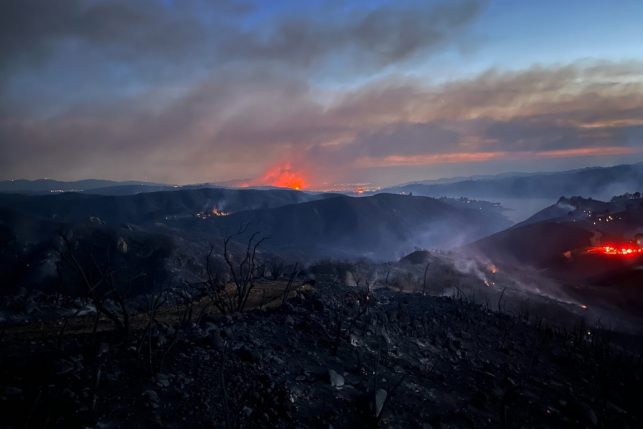 Fires burn across a series of mountains.