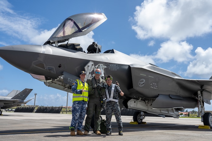 From left: Royal Australian Air Force maintainer, U.S. Air Force Lt. Col. Mike Loringer, 134th Fighter Squadron pilot, and Japan Air Self Defense Force maintainer pose for photo in front of a F-35A Lightning II during exercise Cope North 25 at Andersen Air Force Base, Guam, Feb. 13, 2025.