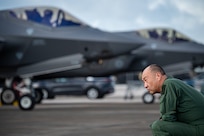 Japan Self Defense Force Maj. Gen. Yukinori Yanagi, director of Defense Plans and Operations Directorate, admires F-35A Lightning II aircraft on the flight line during exercise Cope North 25 at Andersen Air Force Base, Guam, Feb. 13, 2025.