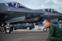 Japan Self Defense Force Maj. Gen. Yukinori Yanagi, director of Defense Plans and Operations Directorate, admires F-35A Lightning II aircraft on the flight line during exercise Cope North 25 at Andersen Air Force Base, Guam, Feb. 13, 2025.