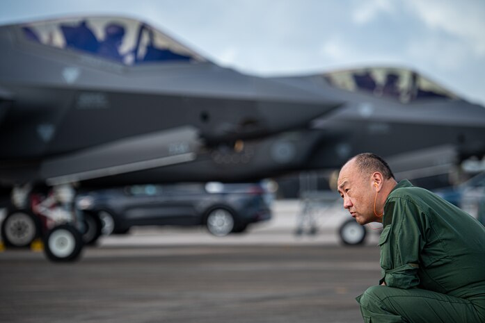 Japan Self Defense Force Maj. Gen. Yukinori Yanagi, director of Defense Plans and Operations Directorate, admires F-35A Lightning II aircraft on the flight line during exercise Cope North 25 at Andersen Air Force Base, Guam, Feb. 13, 2025.