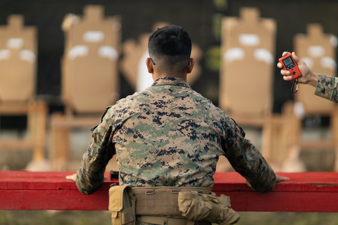 U.S. Marine Corps Cpl. David Salazar, armorer, Headquarters and Service Battalion, U.S. Marine Corps Forces, Pacific, competes in a pistol competition during the Marine Corps Marksmanship Competition Pacific on Marine Corps Base Hawaii, Jan. 29, 2025. The MCMC Pacific is one of five regional competitions that tests combat marksmanship skills beyond annual qualifications. The top 10 percent of competitors earn an invitation to compete in the Marine Corps Marksmanship Match in Quantico, Virginia. (U.S. Marine Corps photo by Lance Cpl. Blake Gonter)