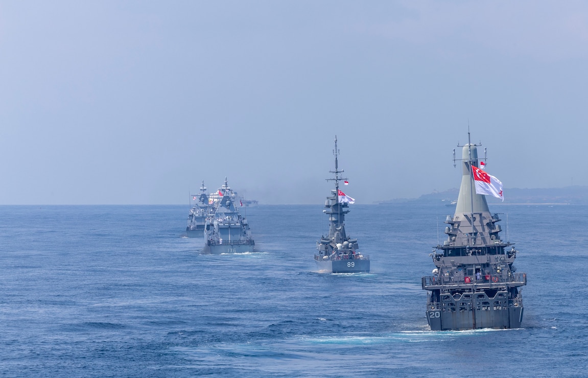 The Martadinata-class frigate KRI Raden Eddy Martadinata (331), the Kedah-class offshore patrol vessel KD Kelantan (F175), the Kedah-class offshore patrol vessel KD Selangor (F176), the Independence-class littoral mission vessel RSS Fortitude (20), and the Victory-class corvette RSS Valour (89) manuever ahead of the Arleigh Burke-class guided-missile destroyer USS Dewey (DDG 105) while in formation during Multinational Exercise Komodo (MNEK) 2025, in the Bali Sea, Feb. 16, 2025.