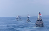 The Martadinata-class frigate KRI Raden Eddy Martadinata (331), the Kedah-class offshore patrol vessel KD Kelantan (F175), the Kedah-class offshore patrol vessel KD Selangor (F176), the Independence-class littoral mission vessel RSS Fortitude (20), and the Victory-class corvette RSS Valour (89) manuever ahead of the Arleigh Burke-class guided-missile destroyer USS Dewey (DDG 105) while in formation during Multinational Exercise Komodo (MNEK) 2025, in the Bali Sea, Feb. 16, 2025.