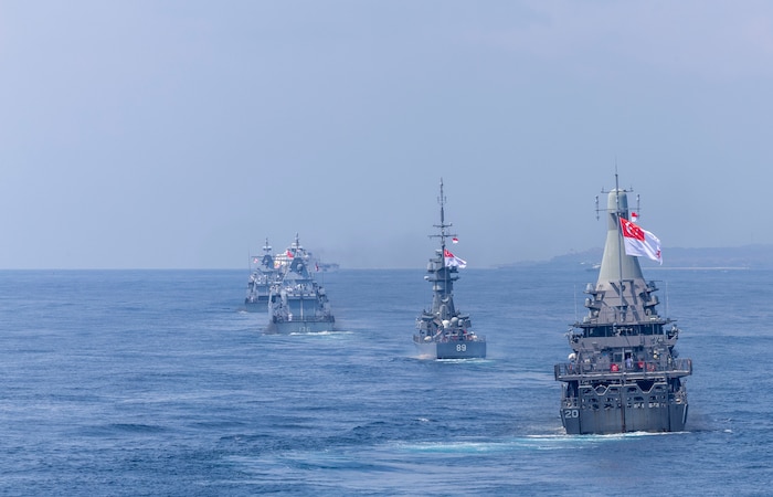 The Martadinata-class frigate KRI Raden Eddy Martadinata (331), the Kedah-class offshore patrol vessel KD Kelantan (F175), the Kedah-class offshore patrol vessel KD Selangor (F176), the Independence-class littoral mission vessel RSS Fortitude (20), and the Victory-class corvette RSS Valour (89) manuever ahead of the Arleigh Burke-class guided-missile destroyer USS Dewey (DDG 105) while in formation during Multinational Exercise Komodo (MNEK) 2025, in the Bali Sea, Feb. 16, 2025.