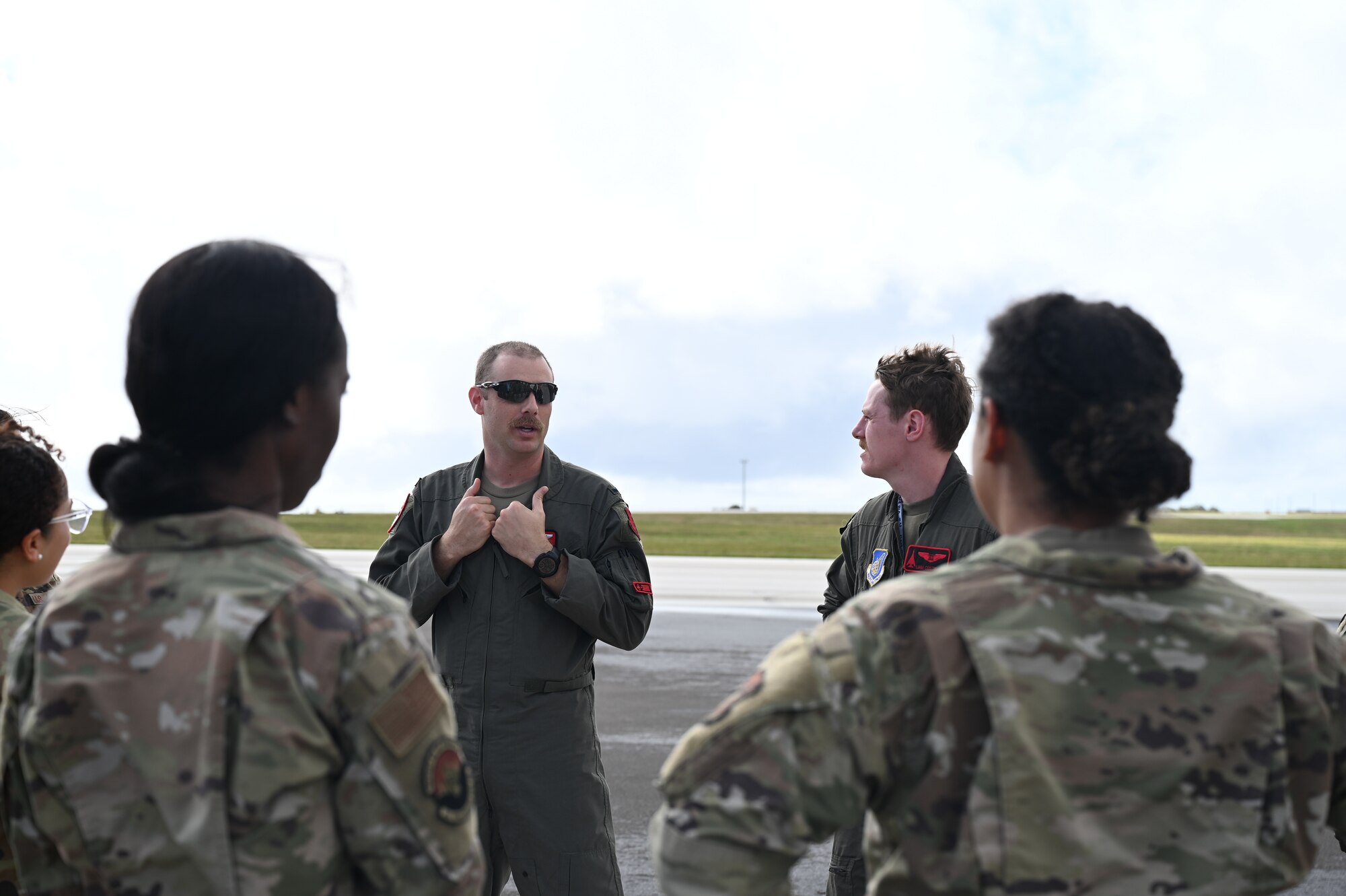 U.S. Air Force 36th Medical Group gather around a B-1B Lancer during their emersion tour at Andersen Air Force Base, Guam, Feb. 10, 2025. Carrying the largest conventional payload of both guided and unguided weapons in the Air Force inventory, the multi-mission B-1 is the backbone of America's long-range bomber force. (U.S. Air Force photo by Airman 1st Class Adasha Williams)