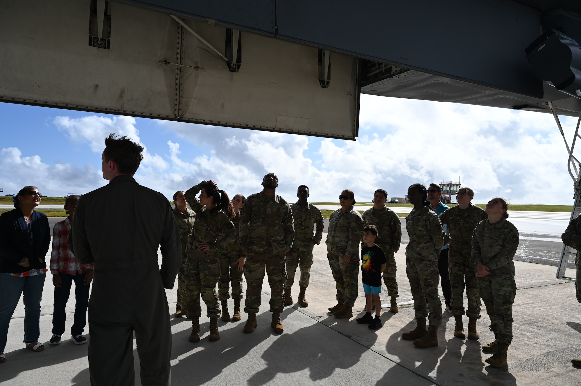 U.S. Air Force 36th Medical Group gather around a B-1B Lancer during their emersion tour at Andersen Air Force Base, Guam, Feb. 10, 2025. Carrying the largest conventional payload of both guided and unguided weapons in the Air Force inventory, the multi-mission B-1 is the backbone of America's long-range bomber force. (U.S. Air Force photo by Airman 1st Class Adasha Williams)