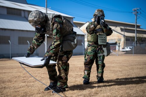 Airmen set up a communication fly-away kit.