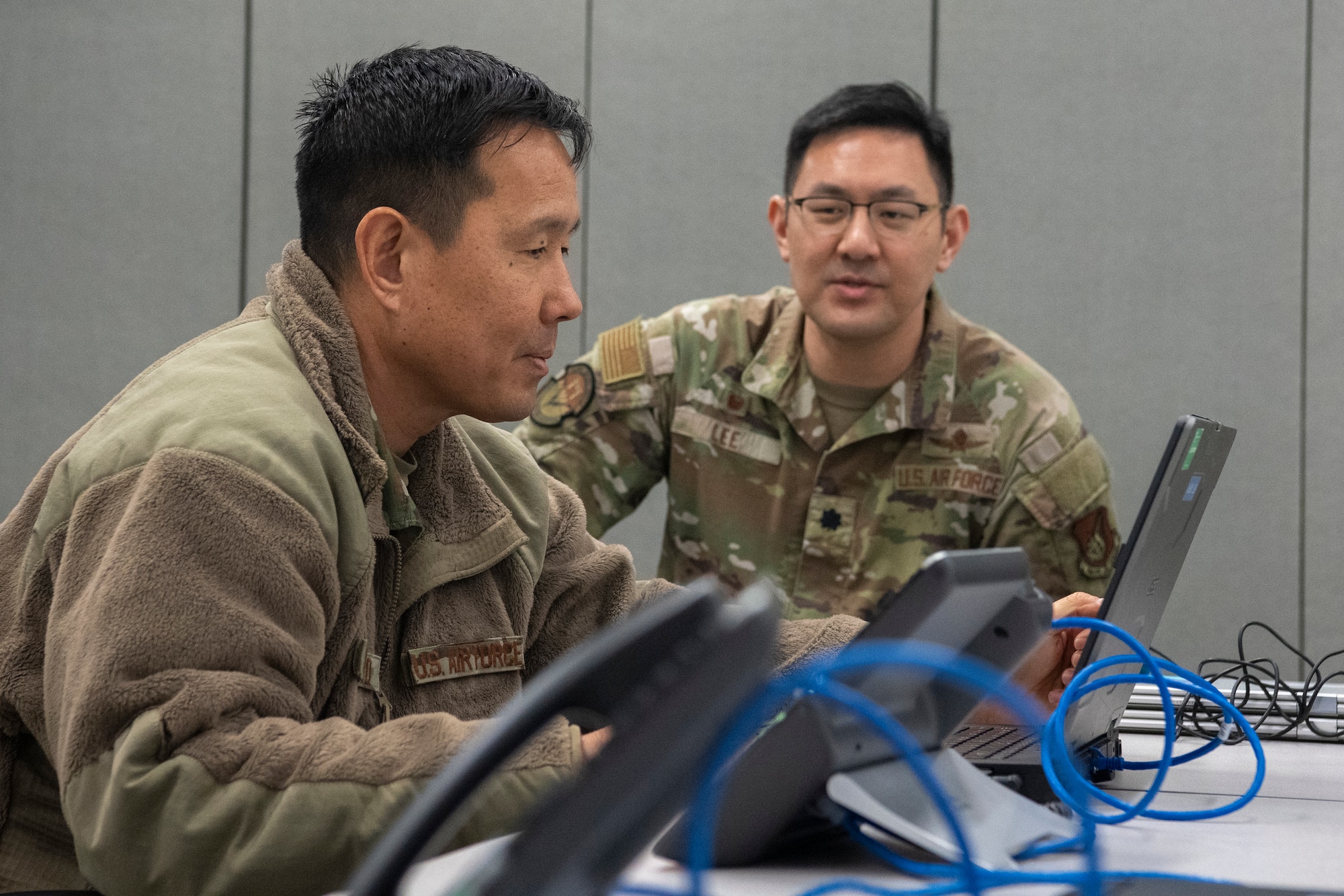 Airmen test the functionality of a communications fly-away kit.