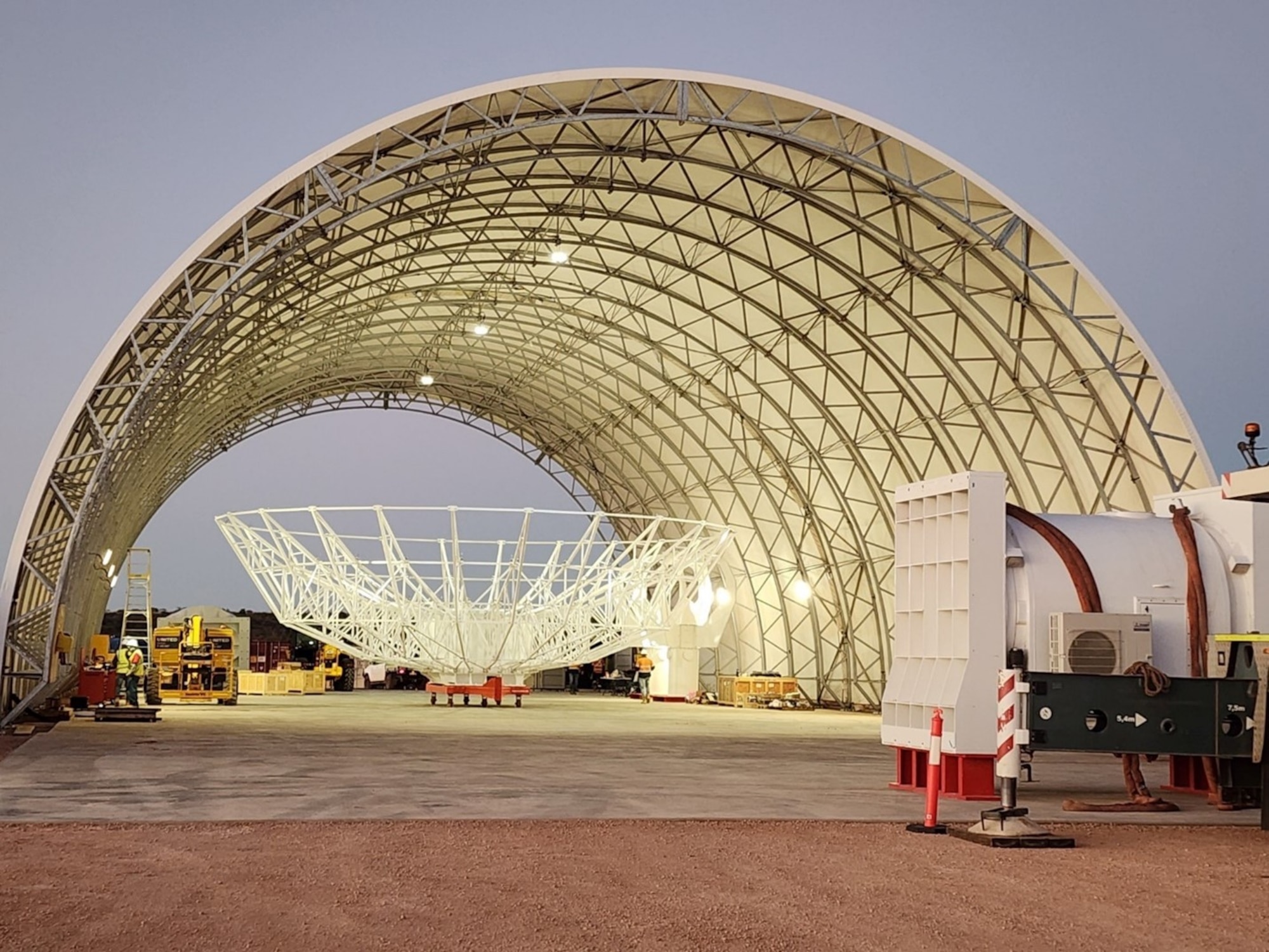A reflector being assembled in the Antenna Integration Structure (AIS) at Site 1 in Australia. DARC, a trilateral partnership between the U.S., the UK and Australia, will provide three radar sites and 360-degree coverage of the GEO belt. Photo Credit: Mike Kortum, Four Sea Group Inc.