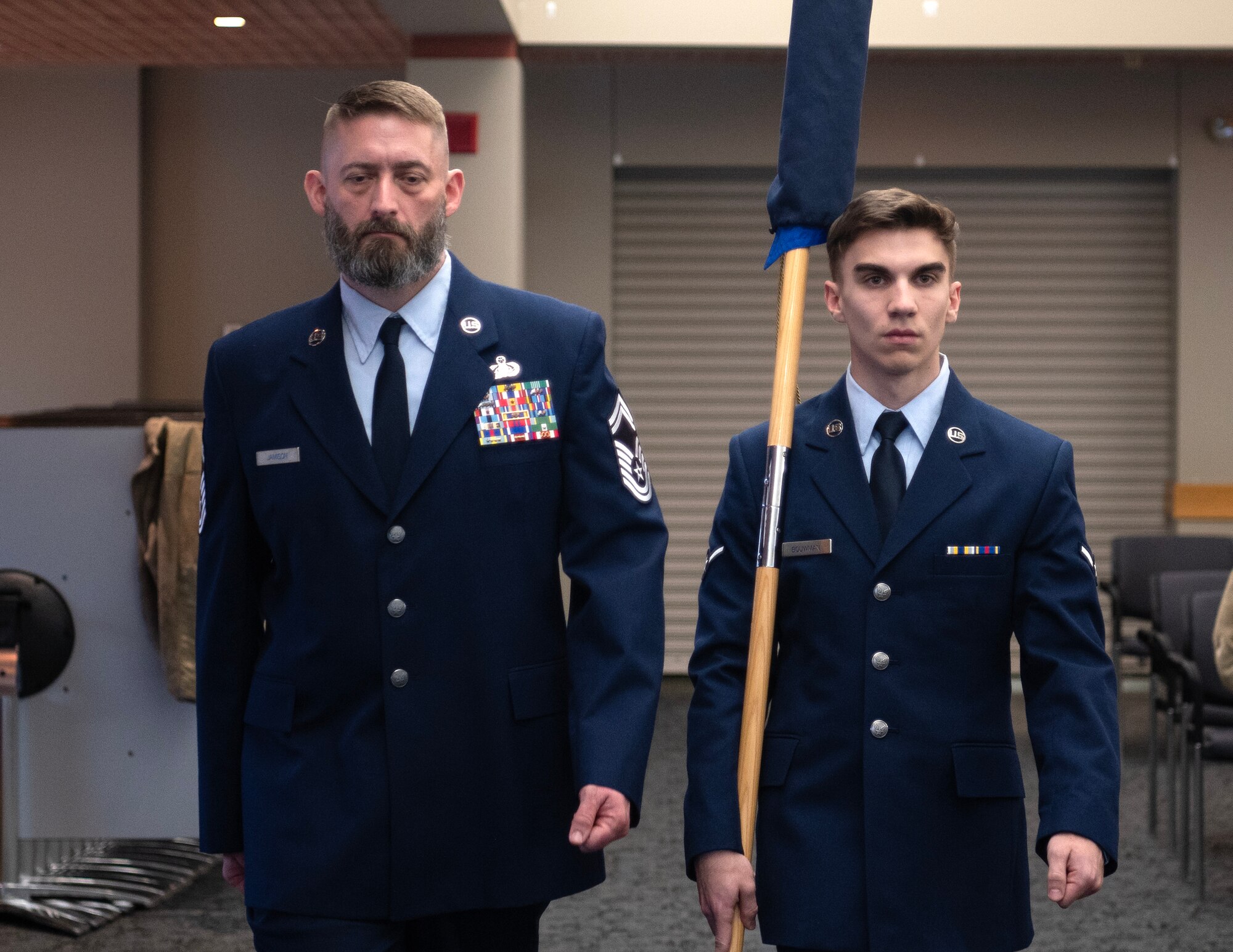 U.S. Air Force Airman Liam Bouman, right, 133rd Communication Flight, carries the unfurled guidon in St. Paul, Minn., Feb. 1, 2025.