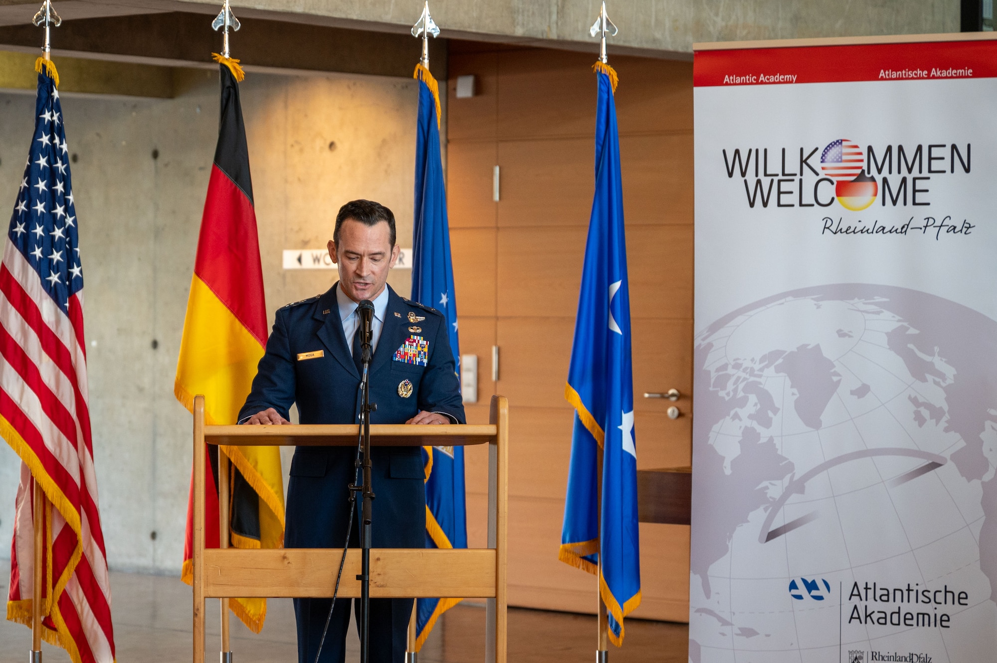 U.S. Air Force Maj. Gen. Paul D. Moga, Third Air Force commander, provides remarks at an art exhibition opening for the 22nd German American Community Office anniversary in Kaiserslautern, Germany, Feb. 18, 2025.The GACO serves as a focal point of information between the local community and U.S. service members stationed within the KMC.
