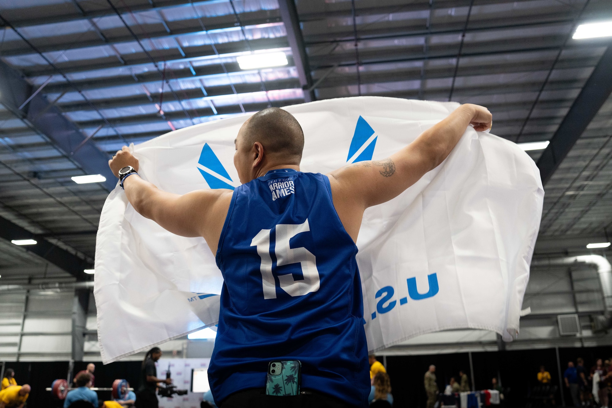 MSgt Aaron Lin cheering on powerlifting competitors during the 2024 Warrior Games in Orlando, Florida
