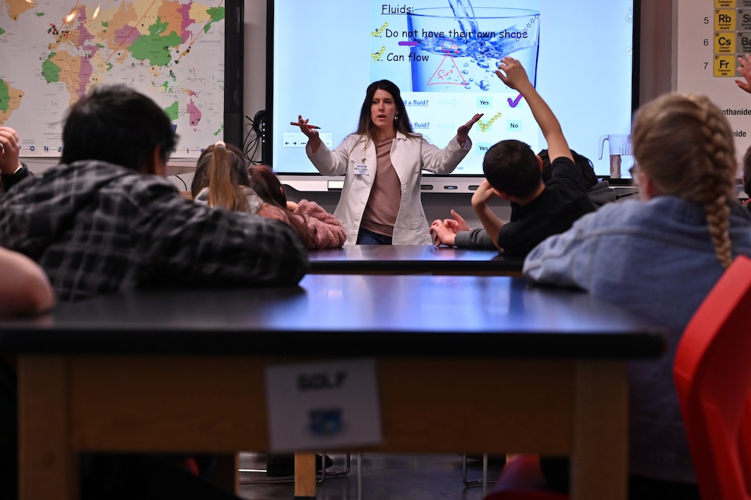 Teacher speaks in front of a class
