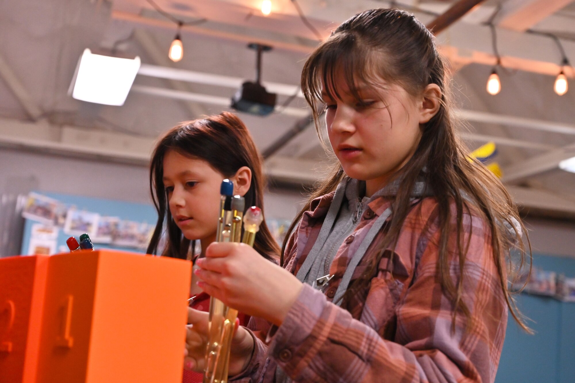 Two students gather supplies