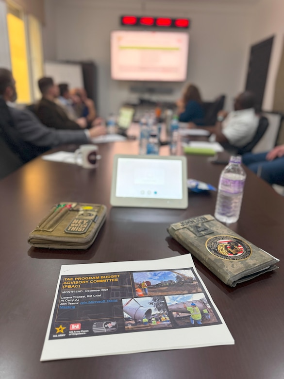 U.S. Army Corps of Engineers Expeditionary District professionals reviewing slides during District Governance Week at the district's Engineering Center of Excellence building in Kuwait, on January 14, 2025.