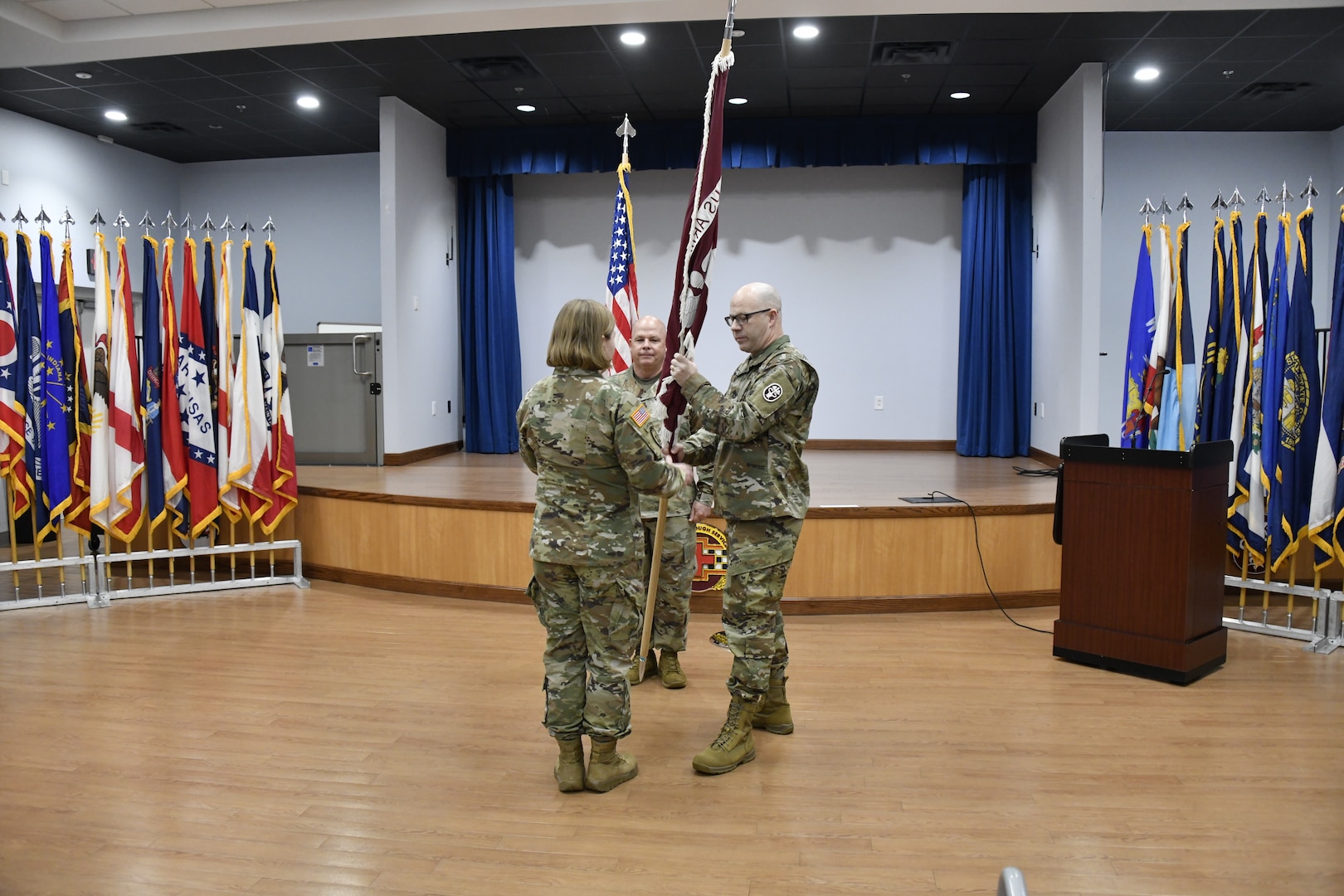 Command Sgt. Maj. Jan E. Miller passes the Winn Army Community Hospital and U.S. Army Medical Department Fort Stewart-Hunter Army Airfield color to hospital director and commander Col. Margaret Berryman to signify his relinquishment of responsibility as senior enlisted advisor for the hospital as clinical services senior enlisted advisor Sgt. Maj. Bryan Wright looks on Feb. 19 in the Patriot Auditorium.

Miller is moving on to Fort Sam Houston, Texas’s Brooke Army Medical Center to be the sergeant major there and continue his service in military health care leadership. (Photo by Chris Rich, U.S. Army)