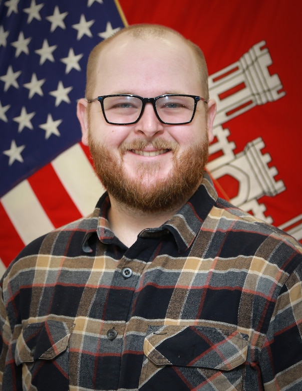 Tanner Cowan, newly licensed U.S. Army Corps of Engineers Expeditionary District professional engineer, stands for his official photo.