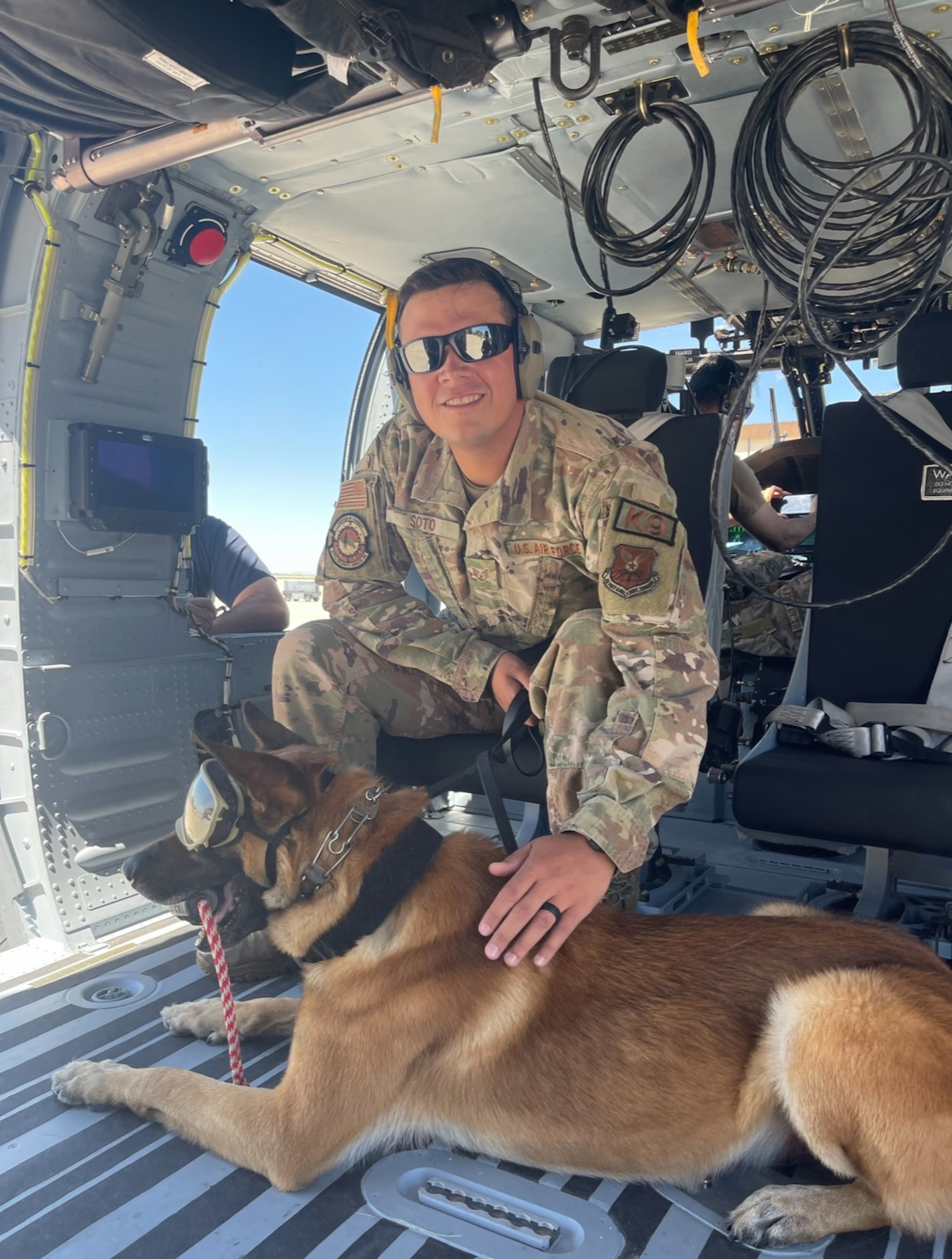 Military Working Dog Bob and his handler, SSgt Brandon Soto, 377th Security Forces Group, on patrol.