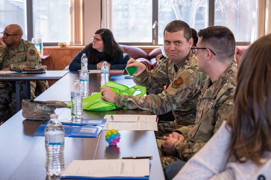 U.S. Air Force Capt. Joshua Albrecht, the chaplain for the 91st Maintenance Group, shows off a toy to Tech Sgt. Nathan Chandler, 91st MXG religious affairs Airman, at the Northern Lights Chapel on Minot Air Force Base, North Dakota, Feb. 12, 2025. Minot AFB’s True North program has four teams embedded in various groups, including the 91st MXG, 5th Mission Support Group, 91st Security Forces Group and 91st Mission Support Group. (U.S. Air Force photo by Senior Airman Kendra A. Ransum)