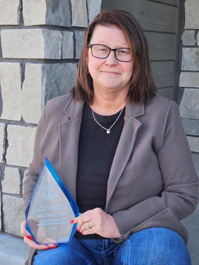 Cara Loken, Reserve Component Transition Assistance Advisor for the Nebraska National Guard and spouse of John Loken, Commander of the 155th Maintenance Group, has been named the 2024 Air Force Association Air National Guard Spouse of the Year. This prestigious award recognizes the significant contributions and support provided by spouses of Air Force personnel across Active Duty, Guard, and Reserve components. Loken's dedication to Nebraska National Guard families and service members for over 25 years exemplifies the vital role family support plays in mission success.