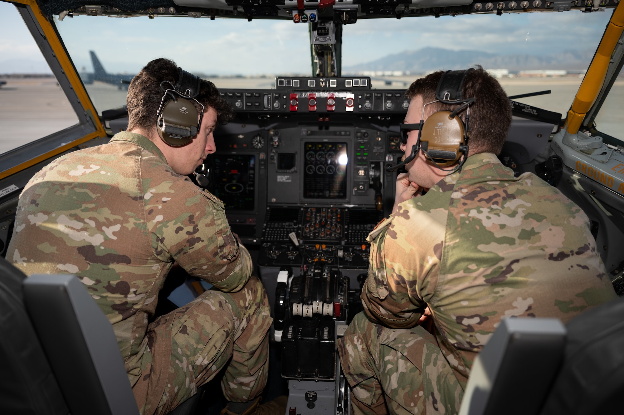 Airman 1st Class Justin Curry, left, and Airman 1st Class Jacob Tripp Hancock, 55th Aircraft Maintenance Squadron avionics journeymen, perform a preflight inspection on a RC-135V/W Rivet Joint before Red Flag 25-1 at Nellis Air Force Base, Nevada Jan. 26, 2025. Red Flag is an opportunity for our warfighters to hone the skills they’ll need for the future fight by operating on their own makes the mission more resilient and survivable. (U.S. Air Force photo by Tech. Sgt. Chris Thornbury)
